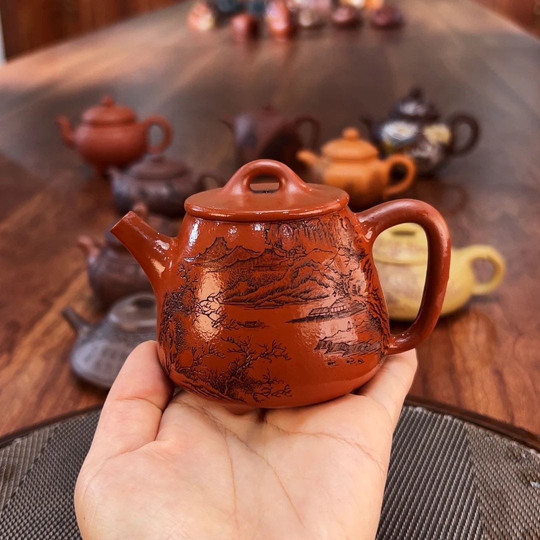 紫砂茶壶坐望图石瓢
