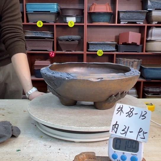 藥***谷紫砂花盆里都藏的什么