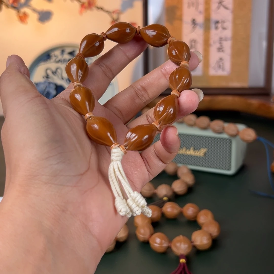 手串橄榄核15×25三面佛