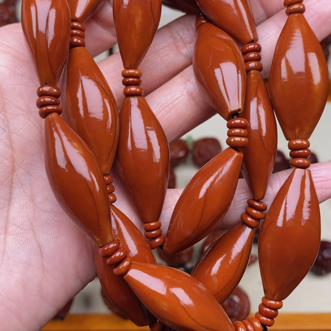 橄榄核吊坠老***i素核，