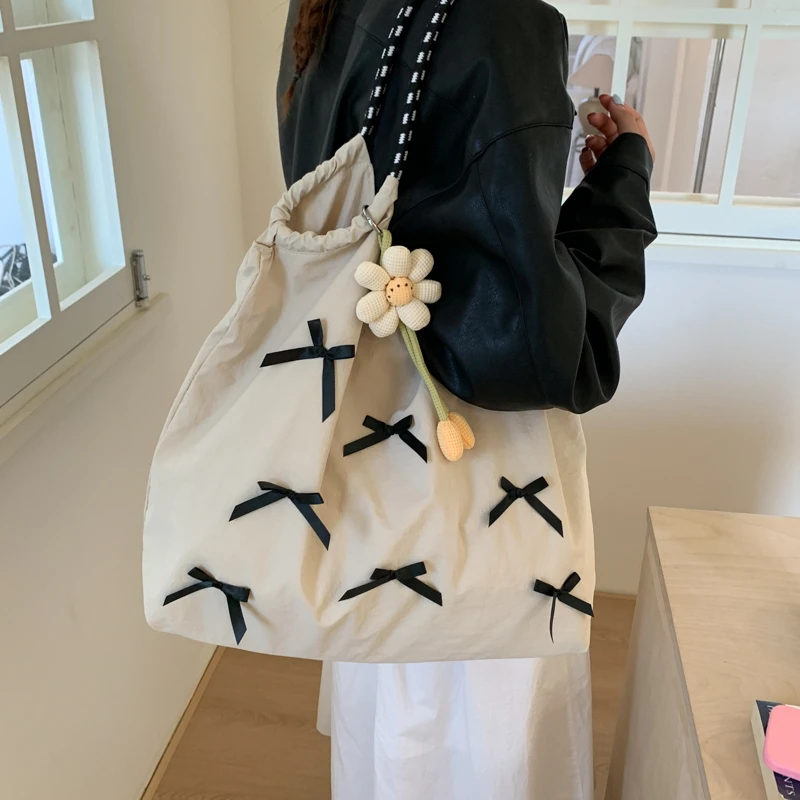 大容量通勤托特包包女2025新款腋下单肩手提包蝴蝶结外出旅行包潮