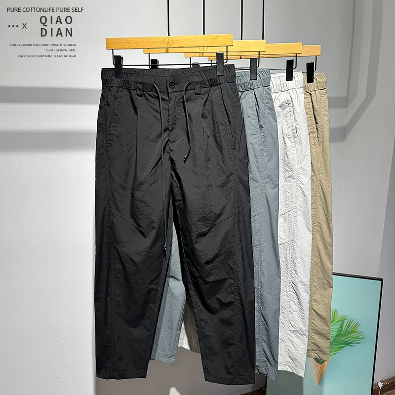韩版时尚简约百搭潮流风设计系绳长裤春季个性帅气男士小脚休闲裤