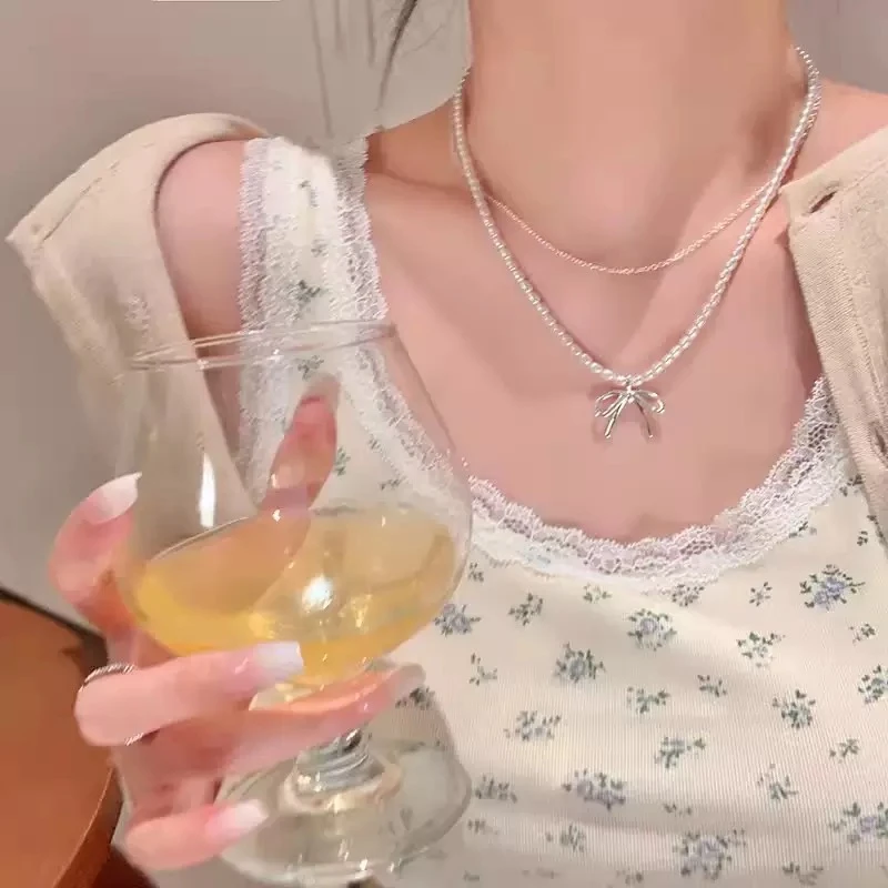 铜合金项链 高级感蝴蝶结仿珍珠项链轻奢小众锁骨链双层叠戴颈链