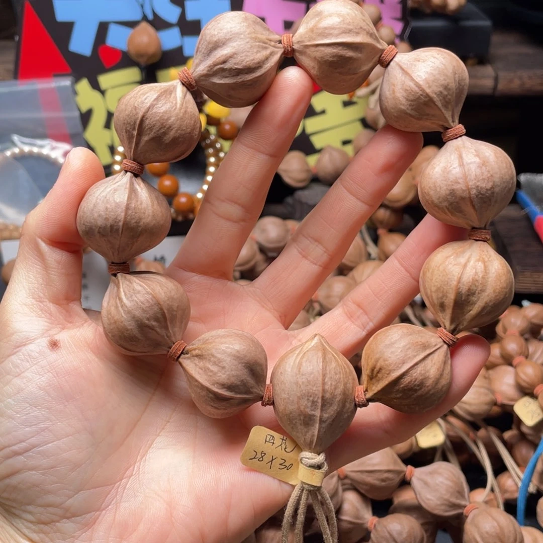 吖***吖橄榄核吊坠2830四花铁核