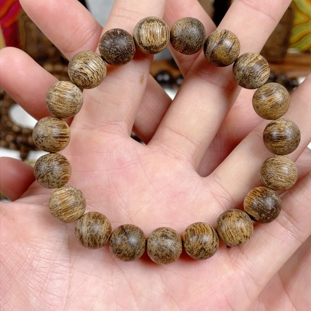 沉香手串乘****咪菩萨棋树心老料1.1