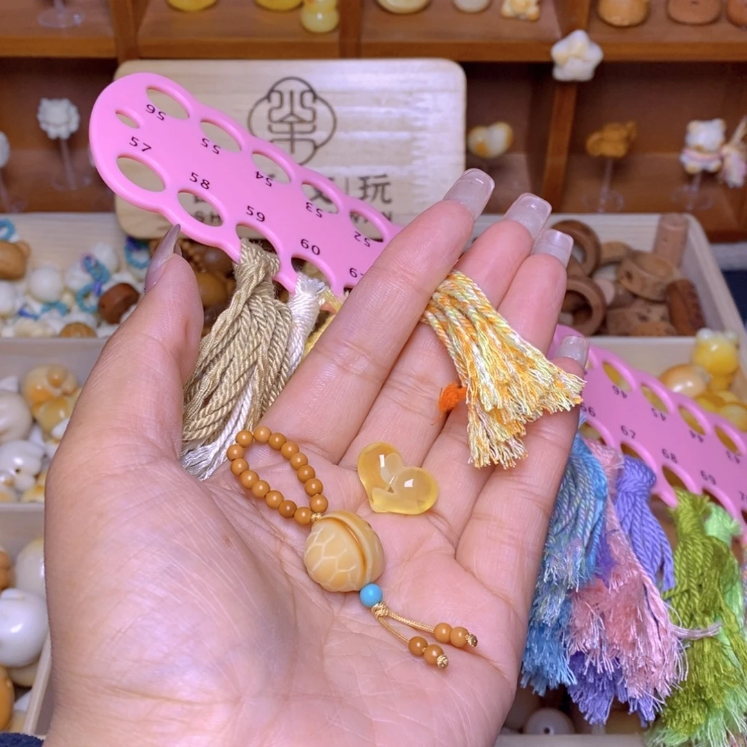 丽***猴头核桃吊坠爱心1.37克富甲提溜62号色流苏