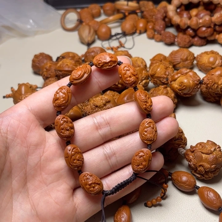 薛***知手串橄榄核小籽螭龙