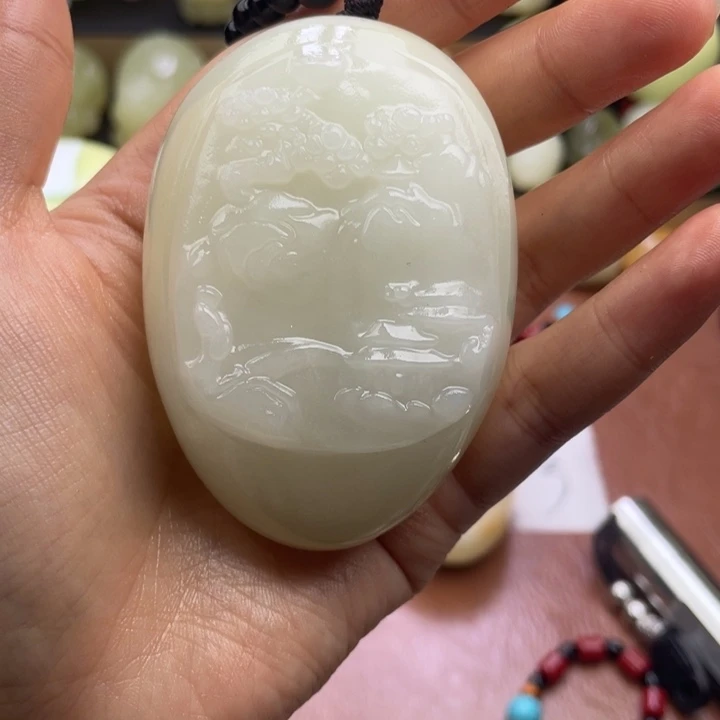 与***解石材天然古青石手把件
