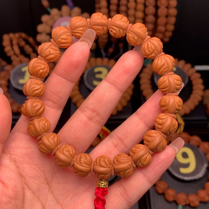 桃核吊坠1.4野生红莲手串