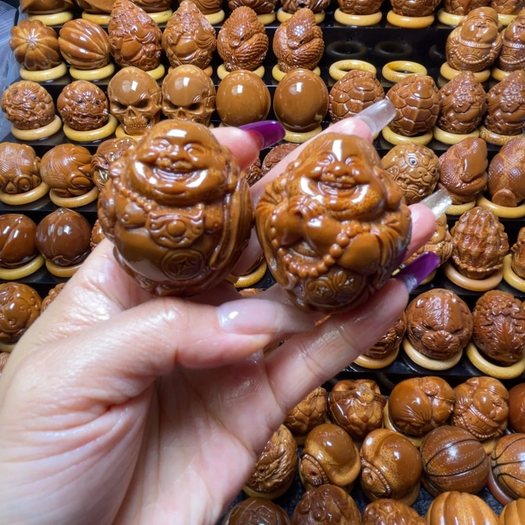 姜***园把件橄榄核橄榄球