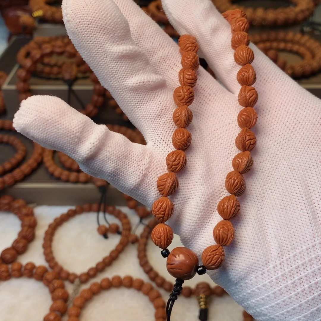 用***1桃核手串秦岭龙纹