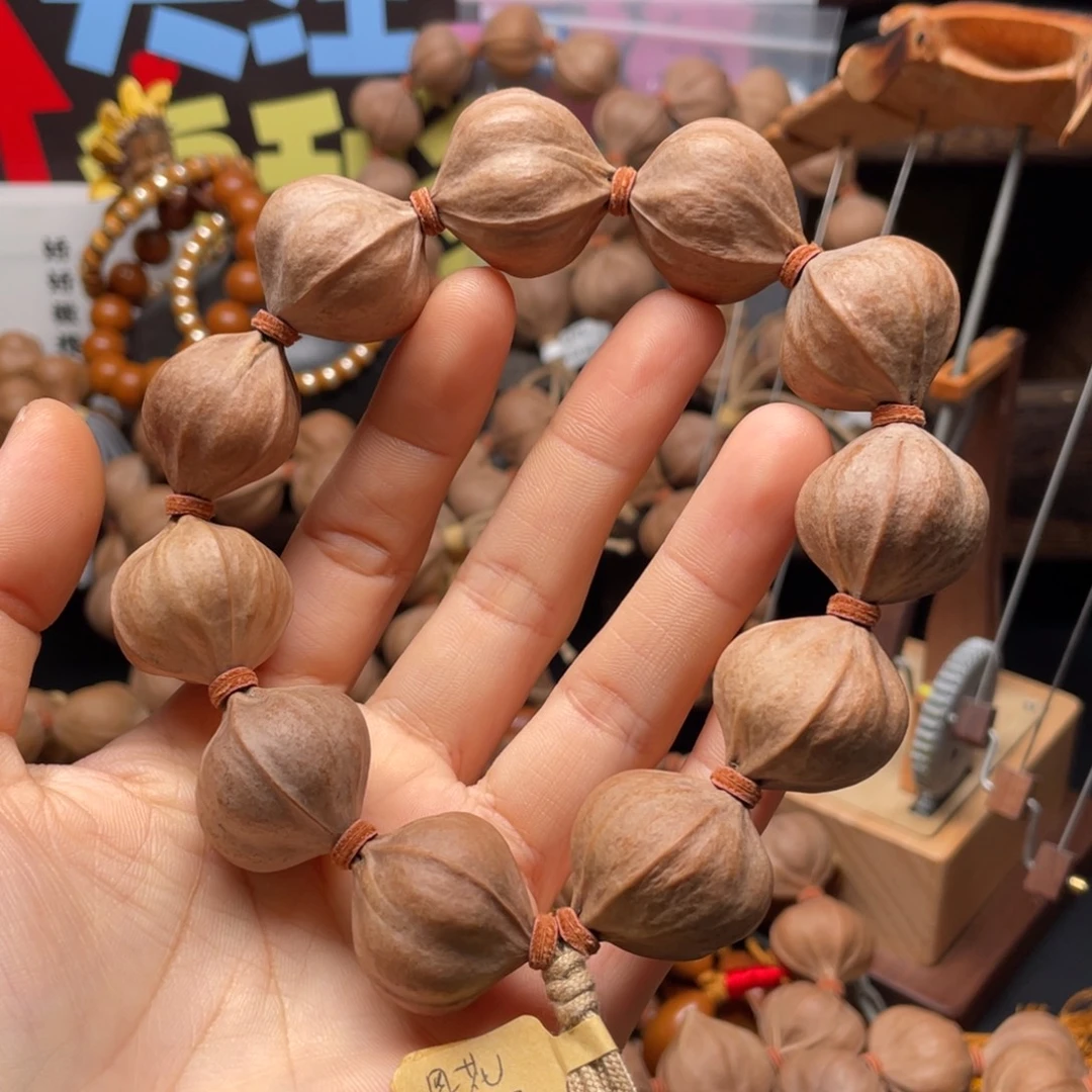 春***雨橄榄核吊坠2527四花铁核