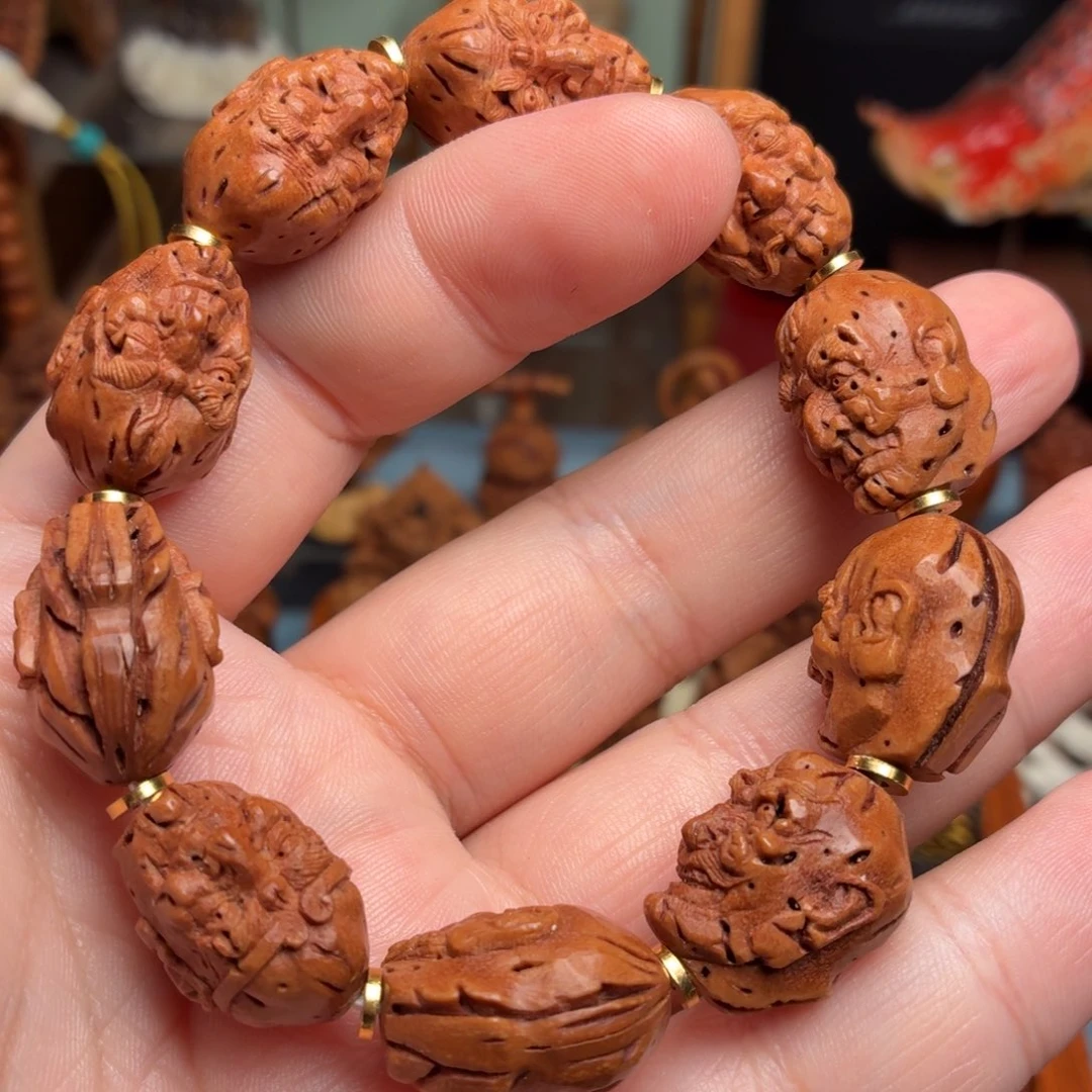 桃核雕刻罗汉手串