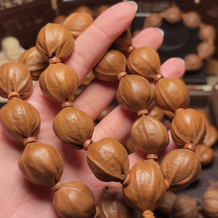 昌***哥橄榄核摆件两条梅林铁精打底