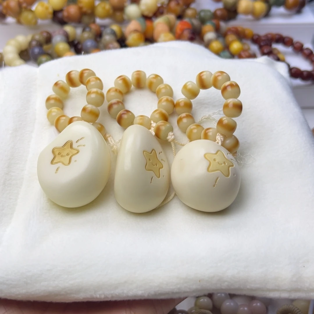 菩提根/象牙果手串星星手把件40mm一串