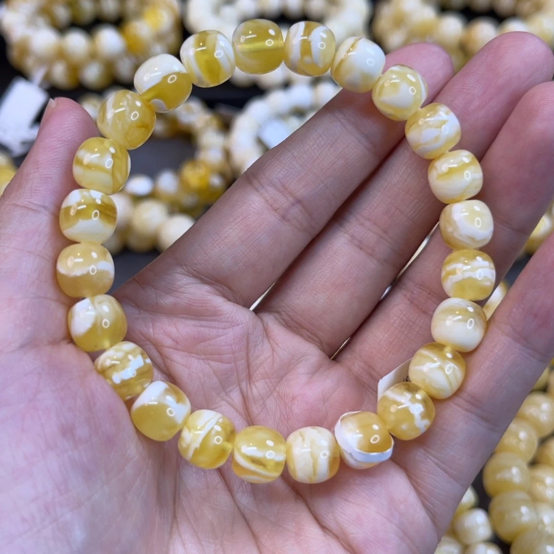 蜜蜡未镶嵌手串9x8.5mm金瓷白溶洞妖花