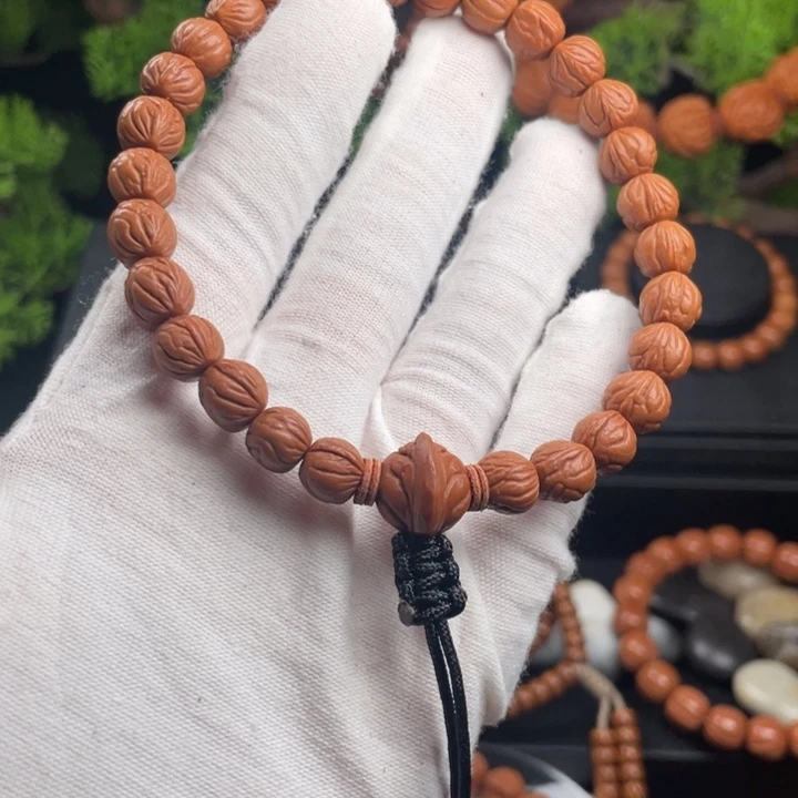 S***1吊坠桃核玉龙脊手持