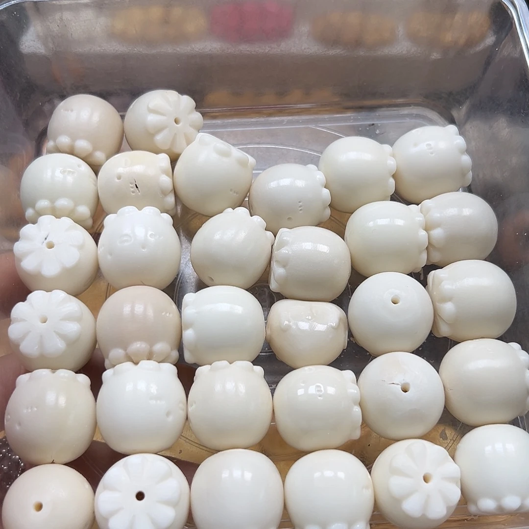 手串菩提根/象牙果瑕疵白章鱼4颗有裂
