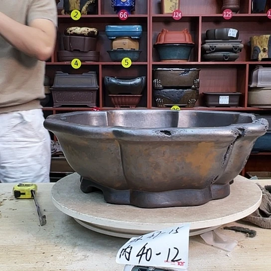 你***~紫砂花盆是以传统家具生产
