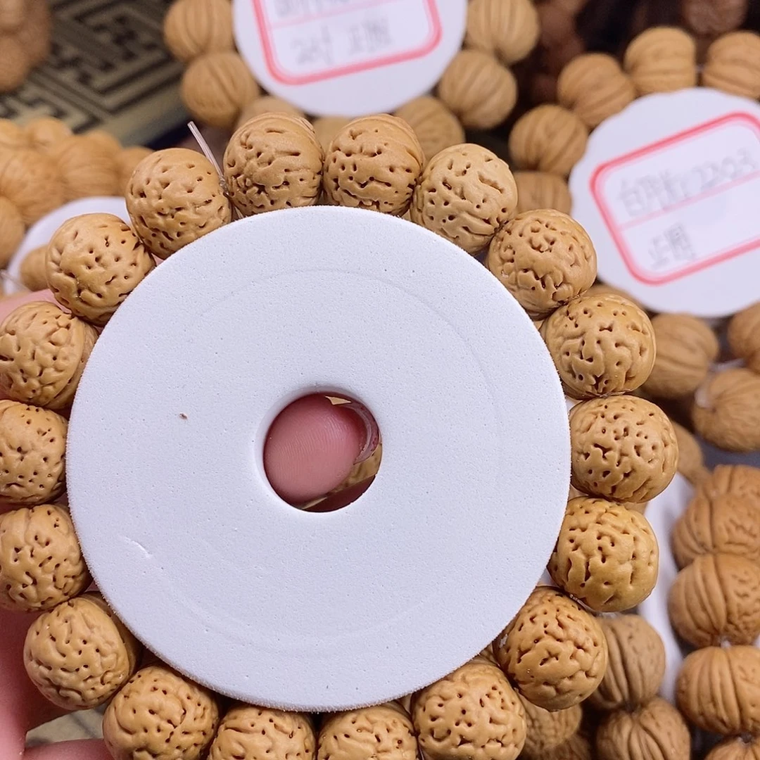 桃核手串张*包野生奶豆1.6