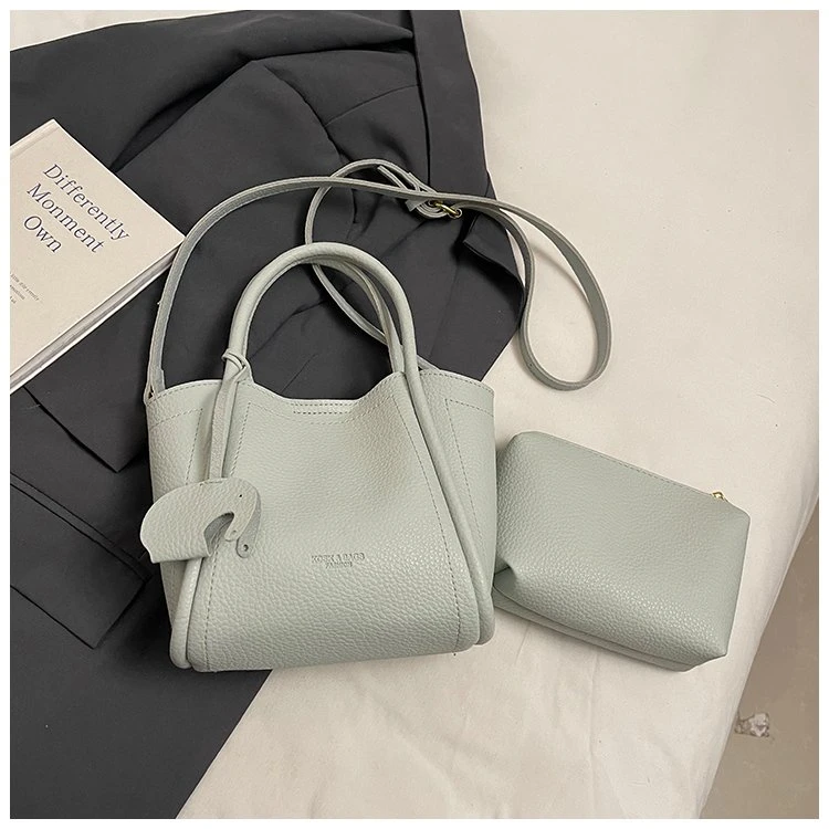 桃柚兜2025夏季新款女包单肩手提小众设计时尚百搭敞口水桶包