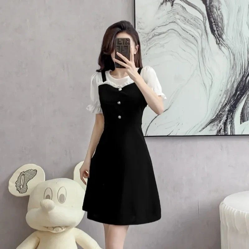 连衣裙女夏季2025年新款时尚短袖拼接显瘦气质假两件法式小黑裙子