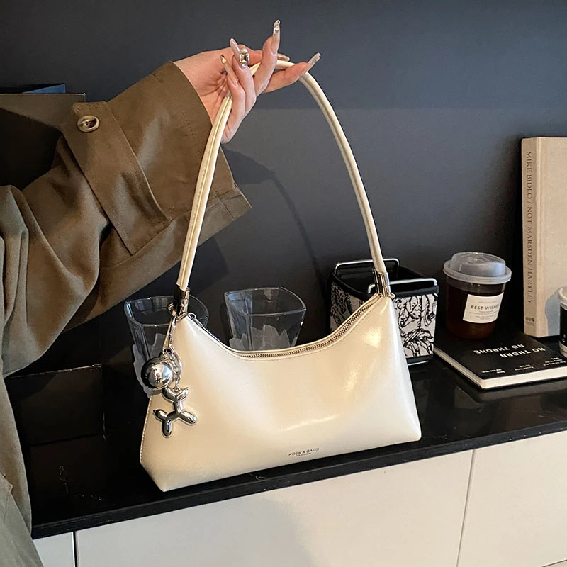 2025春夏新款单肩腋下包包女通勤大容量法棍月牙包简约纯色高级感