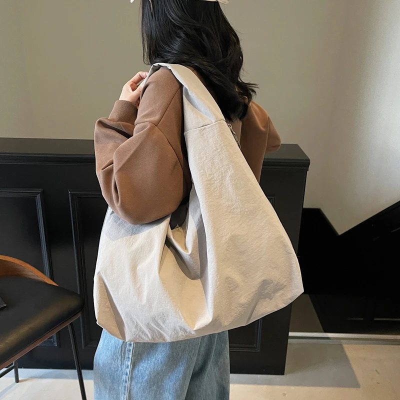 慵懒松弛感帆布包女大容量2025新款春夏百搭休闲单肩包简约饺子包
