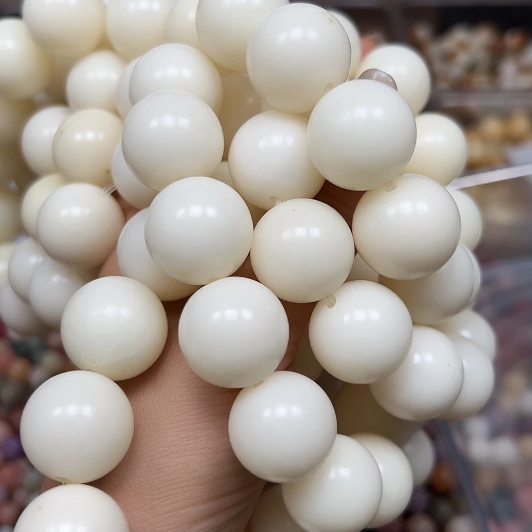 菩提根/象牙果手串瑕疵20奶白圆1条有黑点
