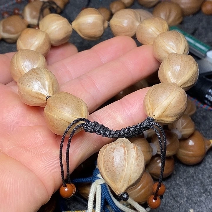 橄榄核手串1.8正圆四花52号