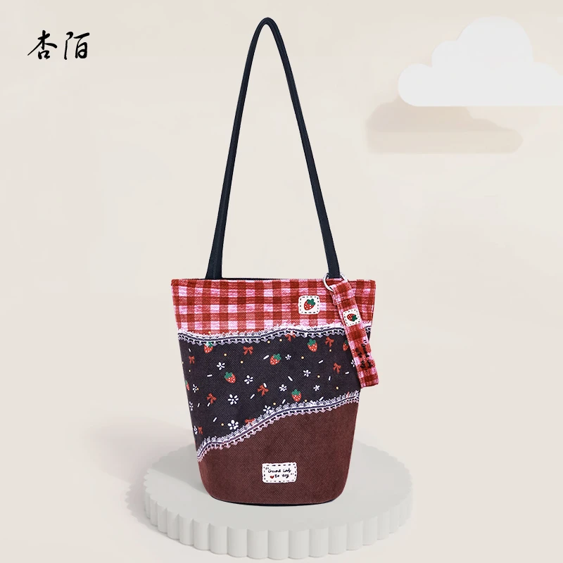 杏陌新年款秋冬原创文艺复古细肩带水桶通勤时尚单肩斜挎长水桶包