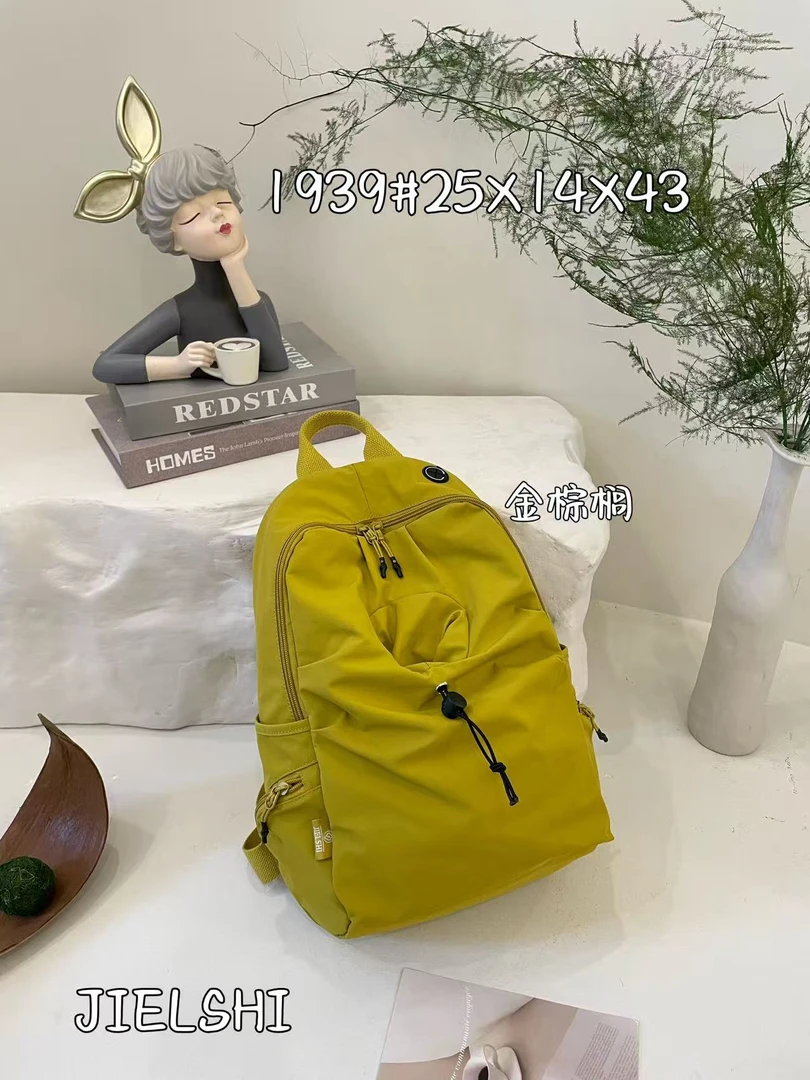 小众简约大容量旅行背包纯色百搭防水通勤双肩包初中高中学生书包