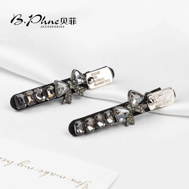 B.【贝菲】黑色蝴蝶结压夹