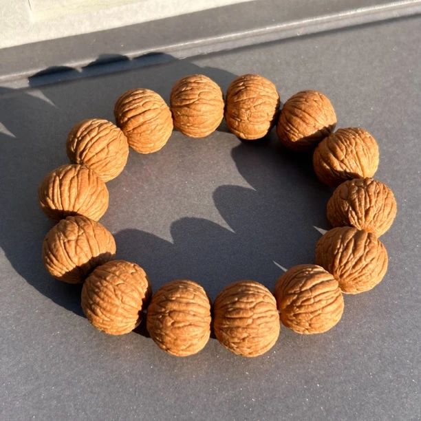 猴头纯野龙头麒麟纹磨盘凤羽自然红手串