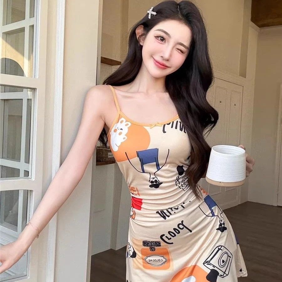 甜辣风杏色趣味印花带胸垫吊带连衣裙女夏季减龄修身短裙