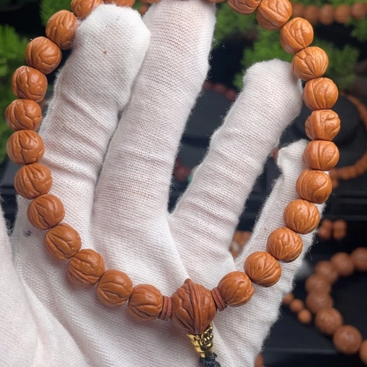 用***5桃核吊坠精品手持