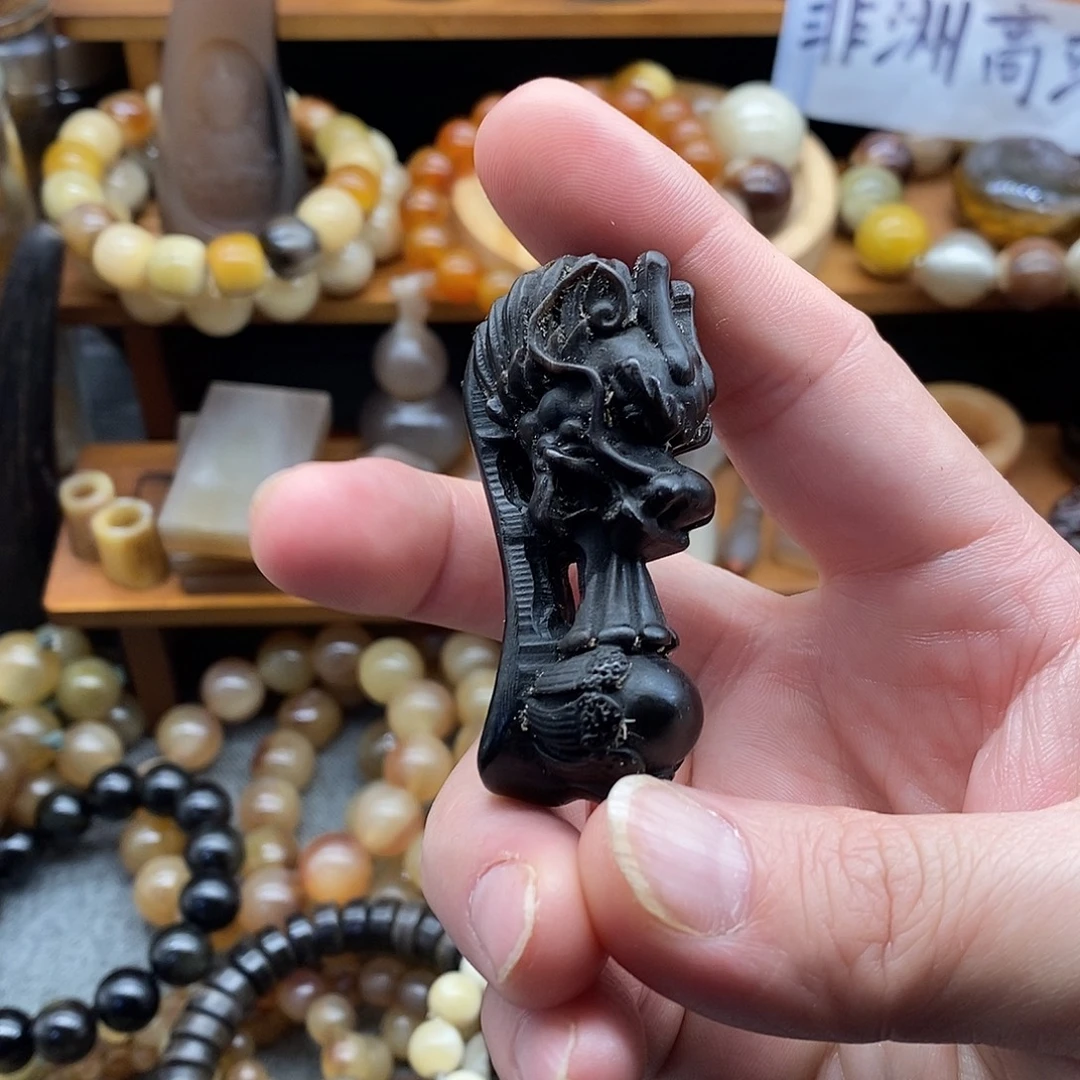 非洲黑水牛角龙头如意手把件