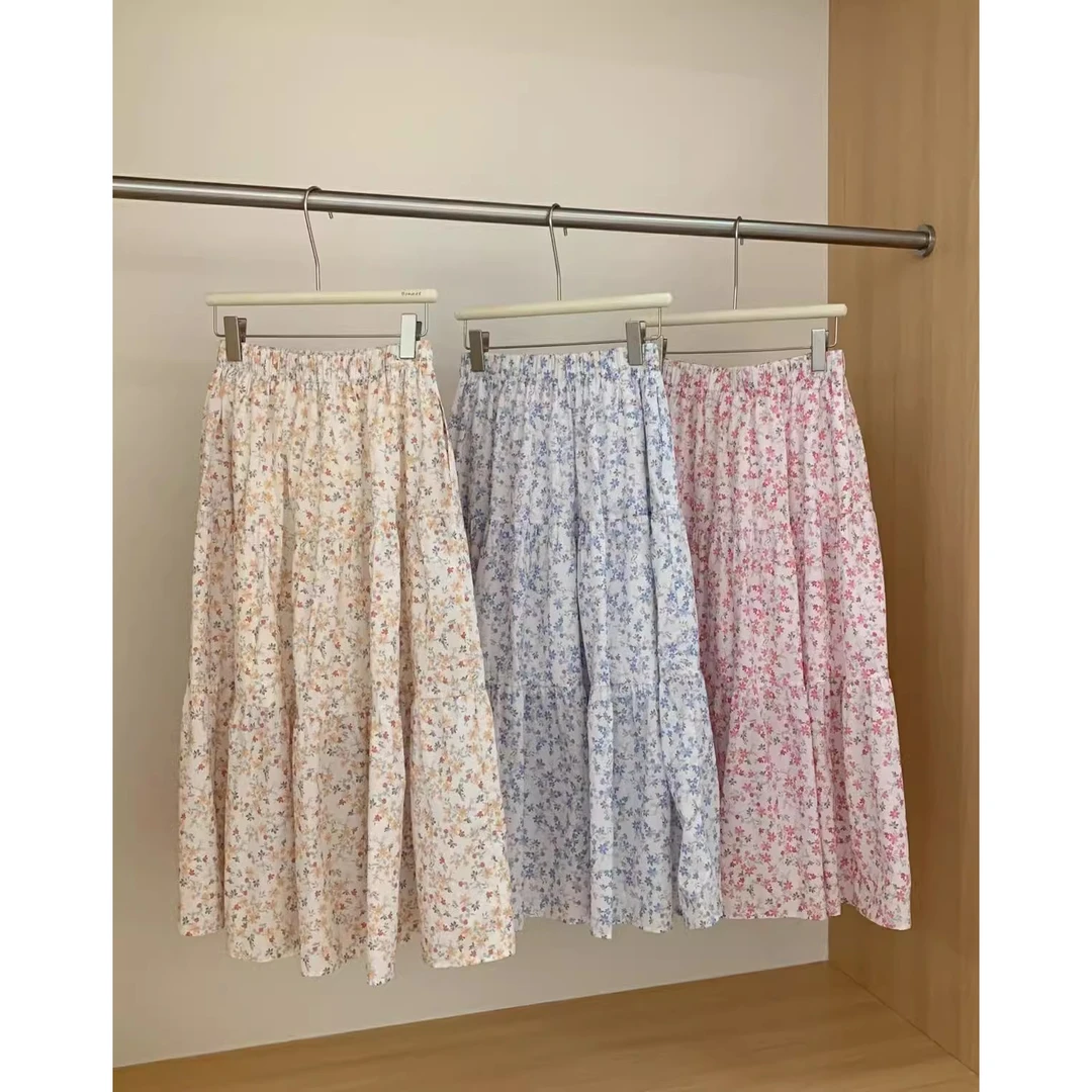 2025年春夏季精梳棉氛围感新款半身裙A字设计感印花过膝口袋长裙