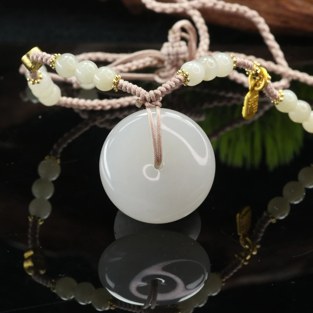 1和田玉烟紫扣/201331上海嘉禾拍卖