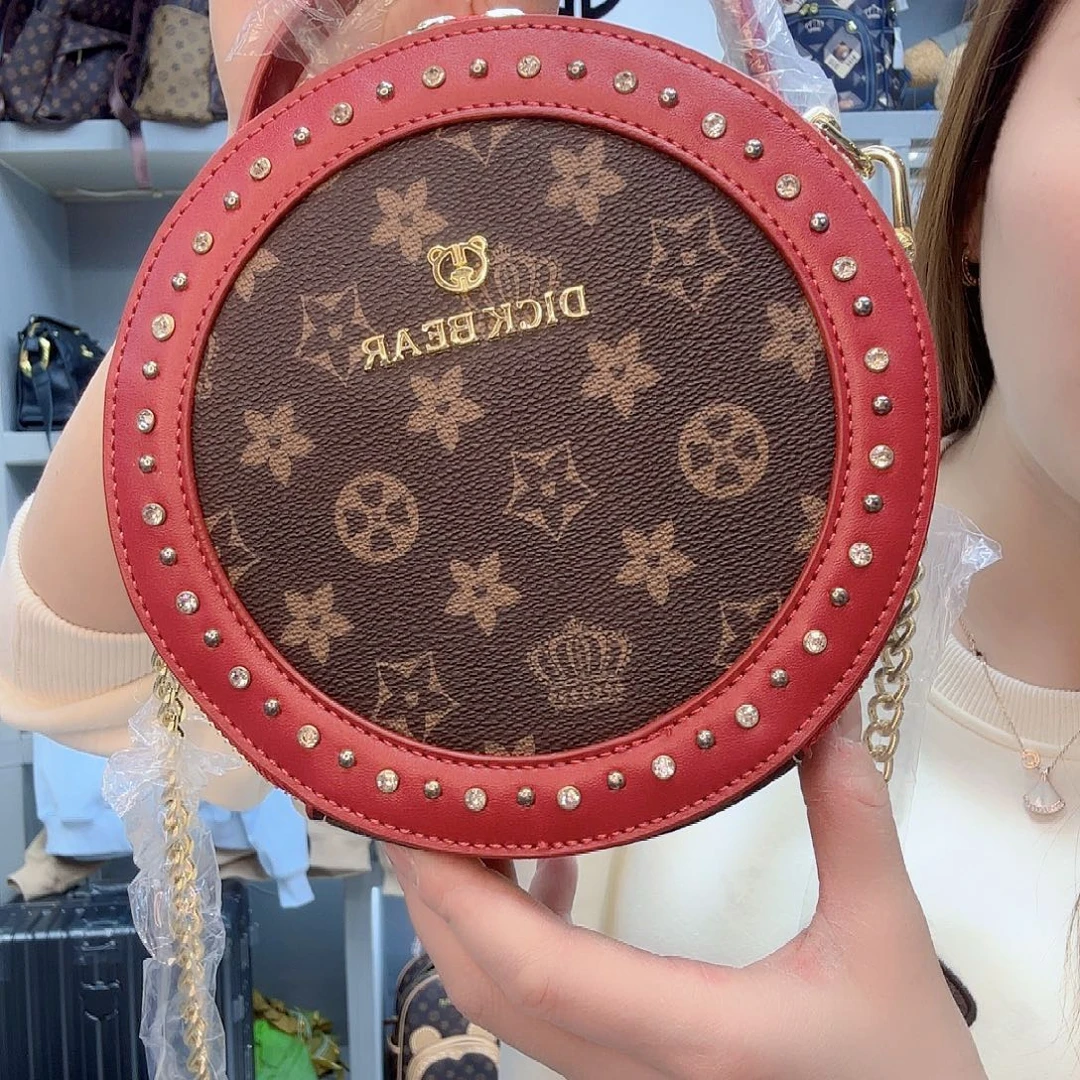 PVC9015梅花咖红手提圆饼包