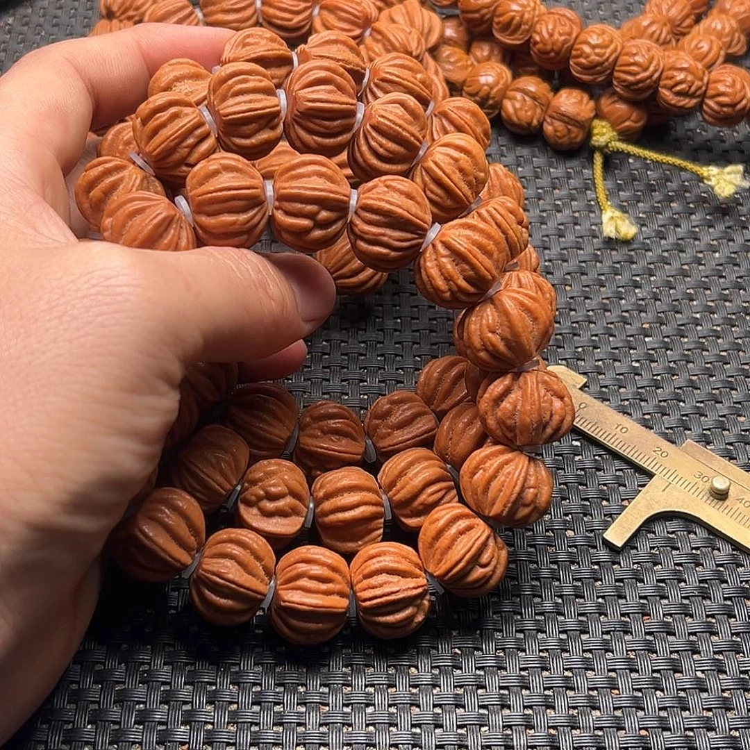 吊坠桃核金八冷手串