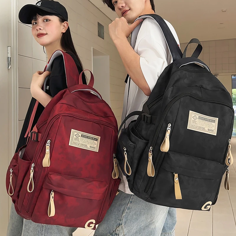 减负护脊书包女初中生高中学生大容量双肩包大学生休闲旅行背包男