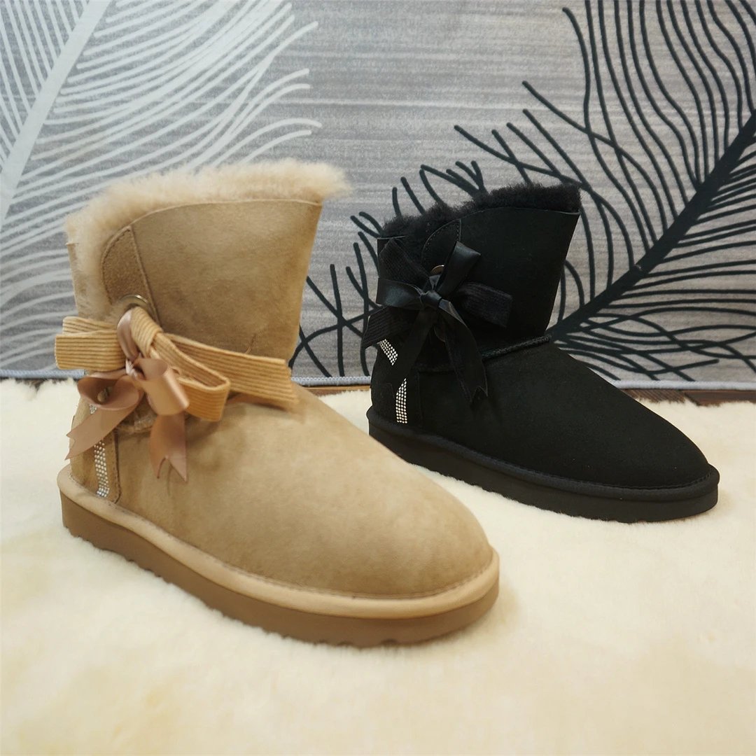 中筒靴冬季新款真皮羊皮毛一体雪地靴 蝴蝶结平跟保暖棉靴87-5