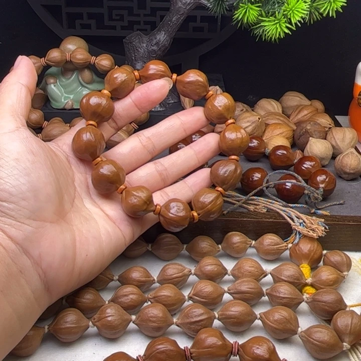永***5手串/手链橄榄核1.9*2.0原皮蒜头铁核