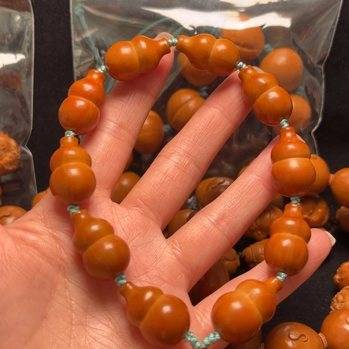 摩***ē橄榄核吊坠葫芦串