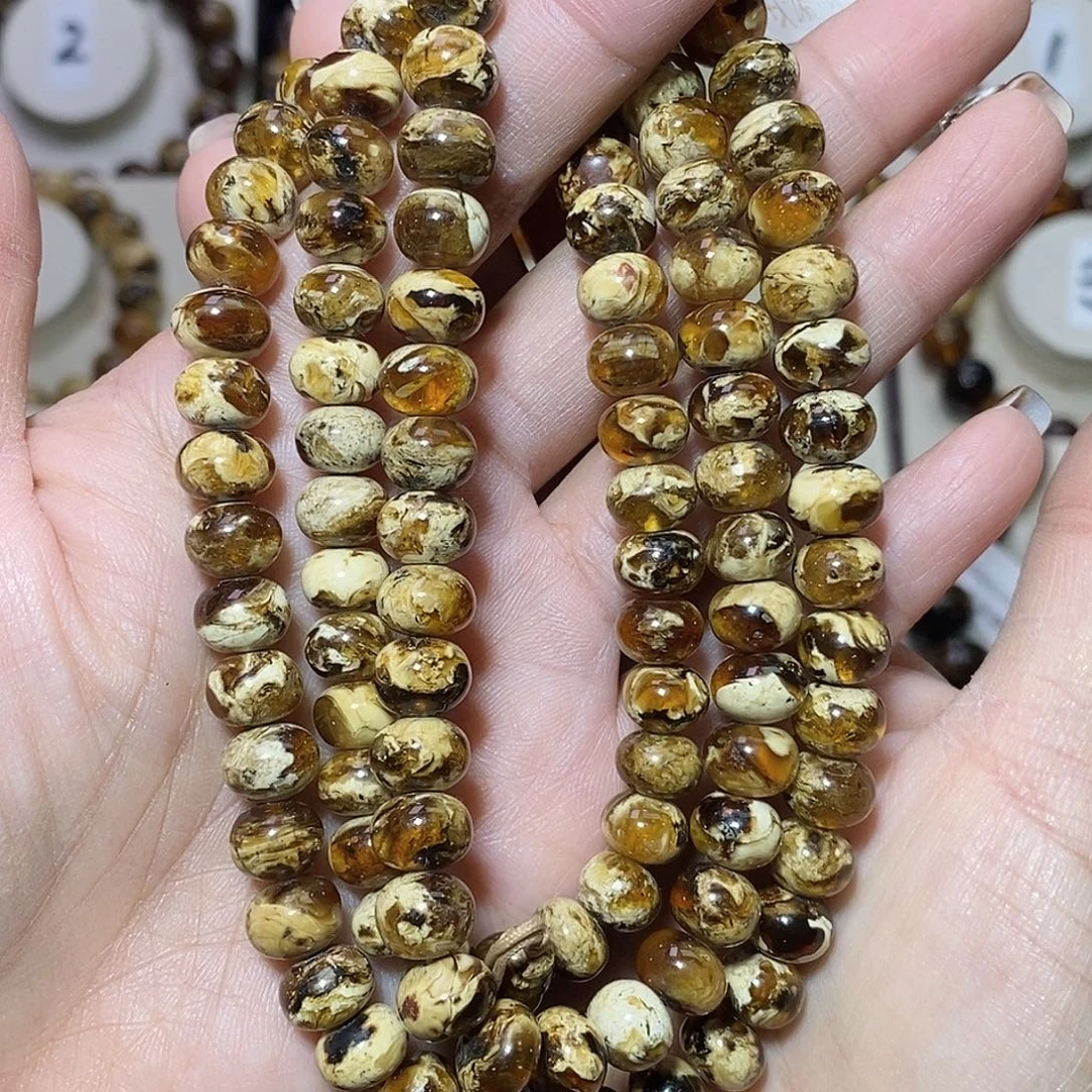 梦***翔琥珀未镶嵌裸石干白溶洞8+