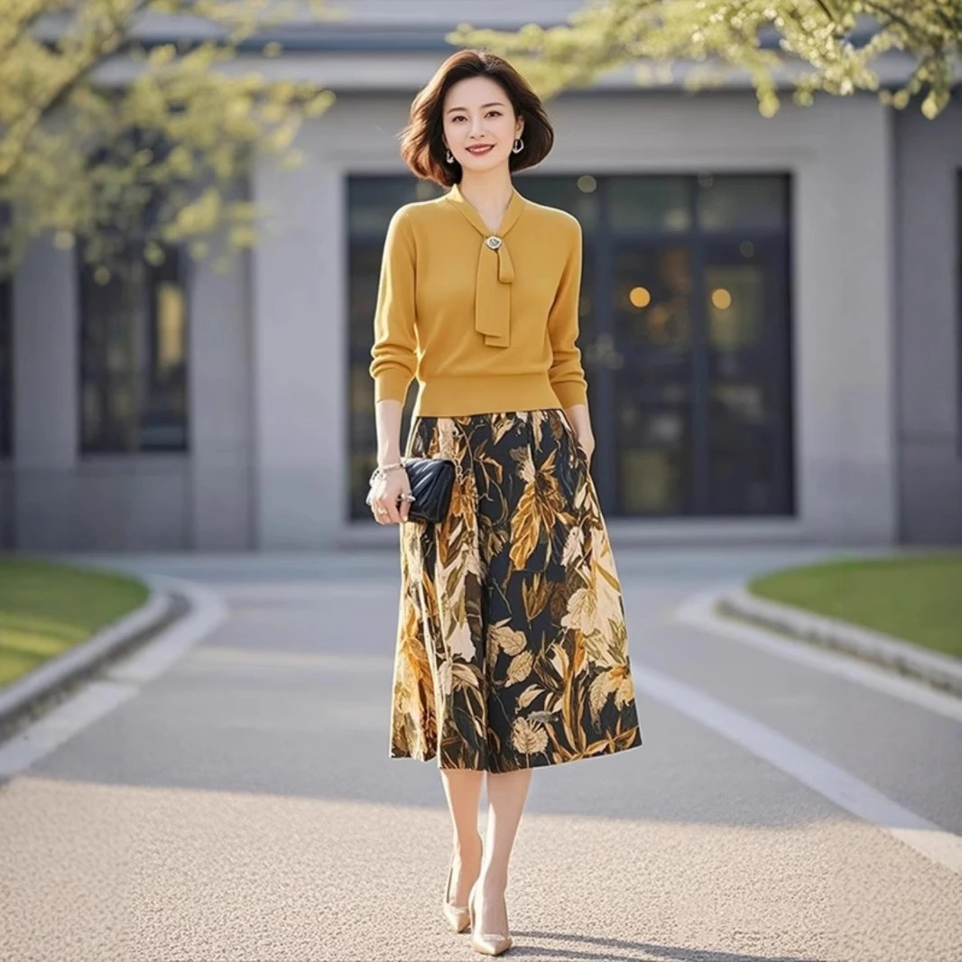黄色针织套装2025年女装秋装新款高级感系带上衣印花半身裙两件套