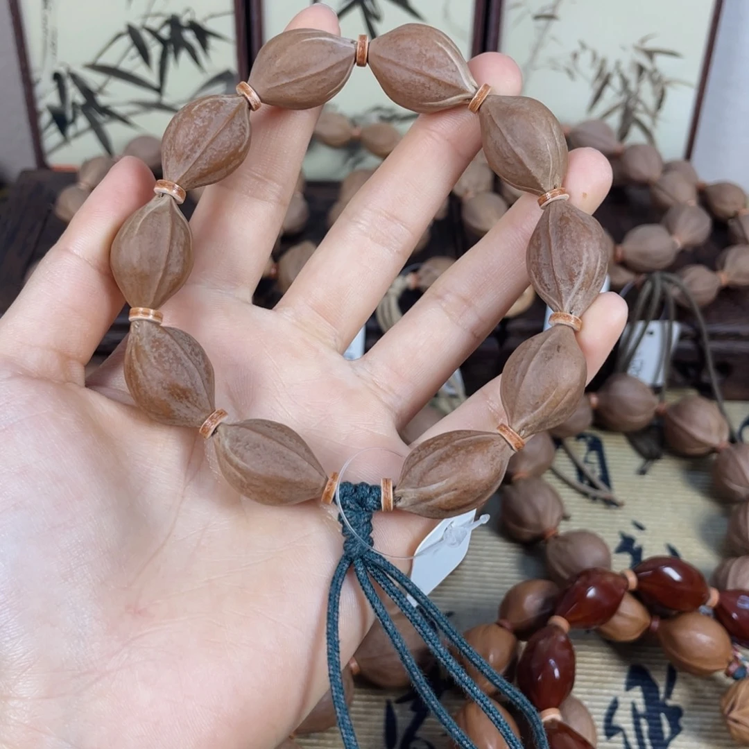 你***亮手串橄榄核梅林铁核1524