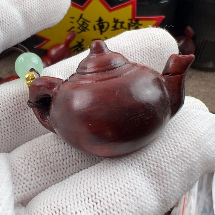 木海南红降黑金把把壶瑕疵