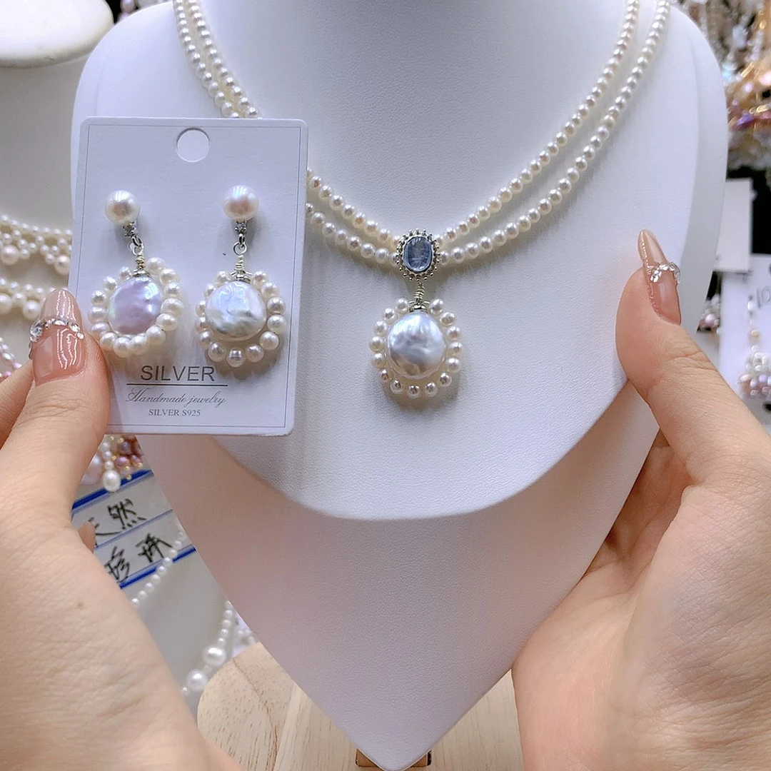 银S925镶嵌耳饰淡水珍珠啦**。